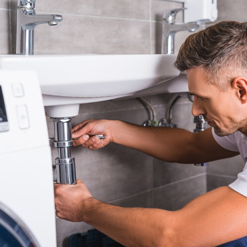a plumber installing a new sink